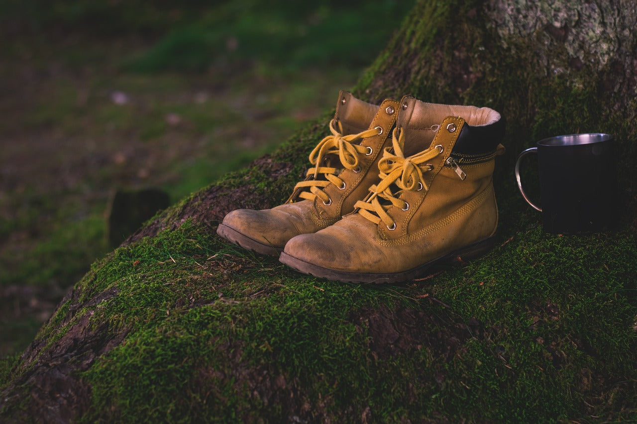 Hiking boots with coffee cup